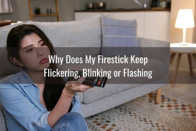 Annoyed female sitting on living room floor watching TV