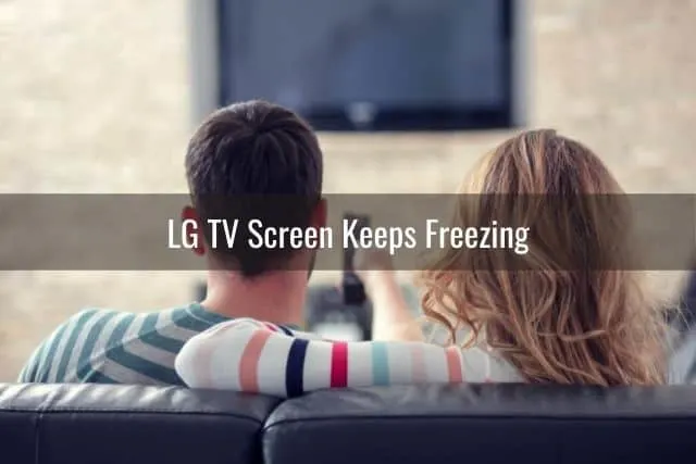 Young couple trying to watch TV that won't turn on