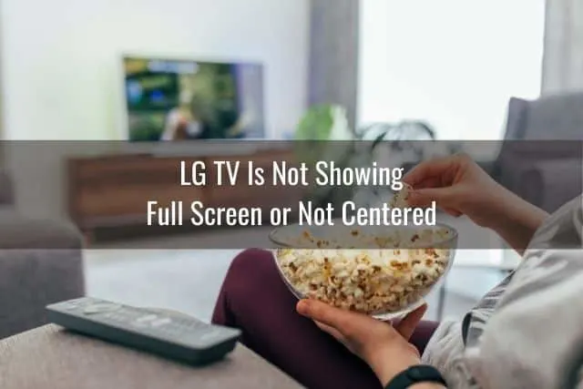 Watching TV with bowl of popcorn on lap