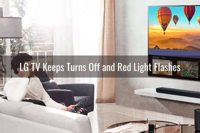 Couple sitting on sofa watching TV