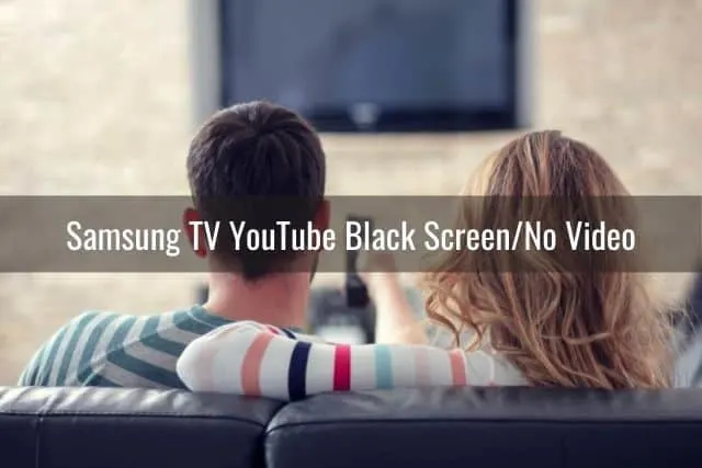 Male and female sitting on couch about to watch TV
