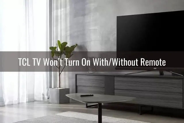 Modern living room with TV sitting on media table