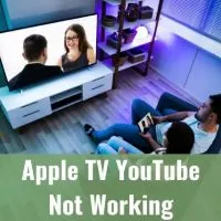 Top view of male and female watching move on TV at night