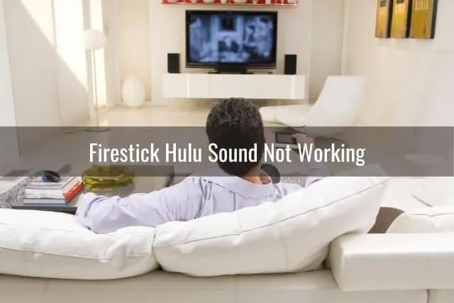 Male watching TV on sofa