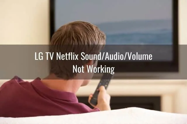 Male using TV remote to change channels