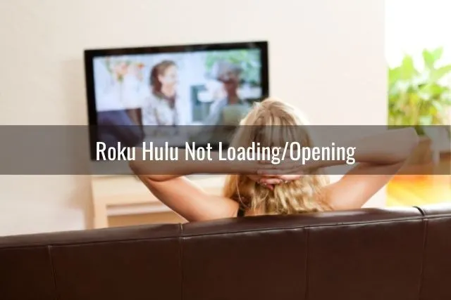 Female watching TV in living room couch