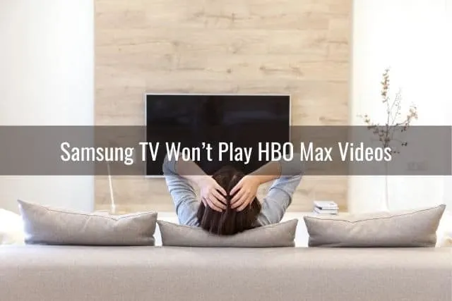 Female sitting on sofa with TV in front
