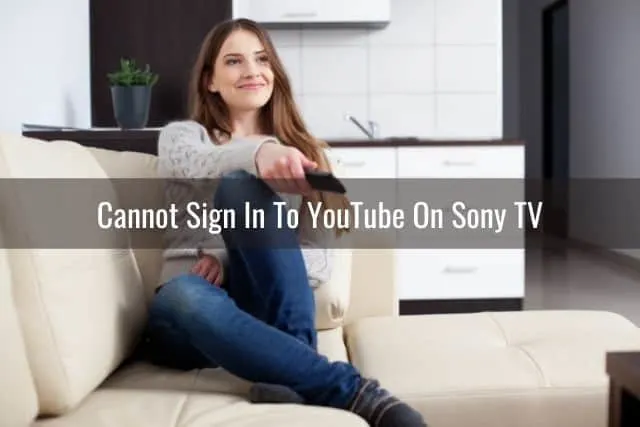 Female turning on TV with remote