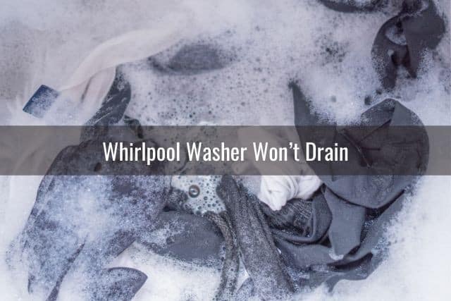 Washing machine tub filled with clothes and water