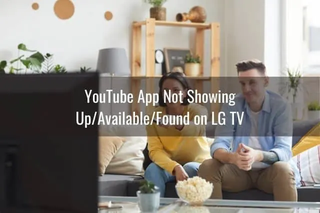 Male and female couple eating popcorn and watching TV