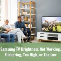 Grandfather, dad and son sitting on sofa watching TV
