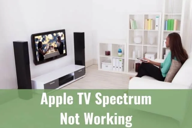 Woman using a TV remote to change channels