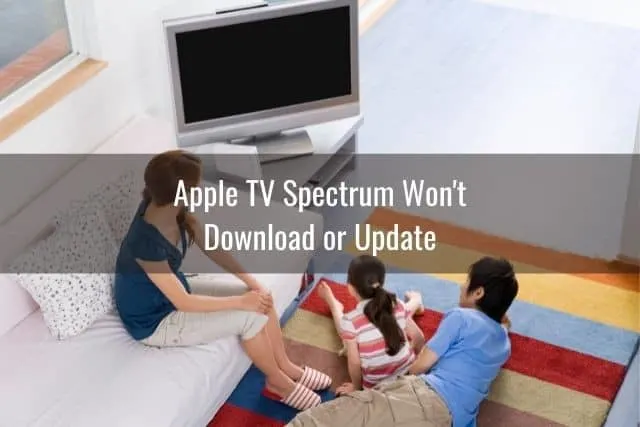 Family of 3 waiting for TV to turn on