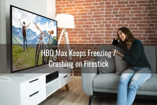 Female with remote watching TV movie
