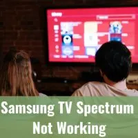 Couple fixing the channel of their TV
