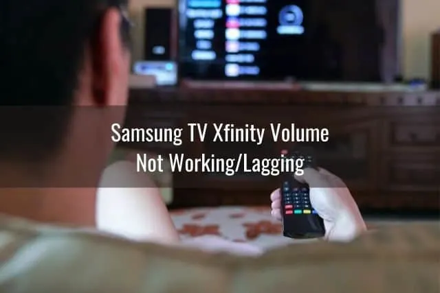 Male using TV remote to change programming