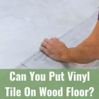 Worker installing new vinyl tile