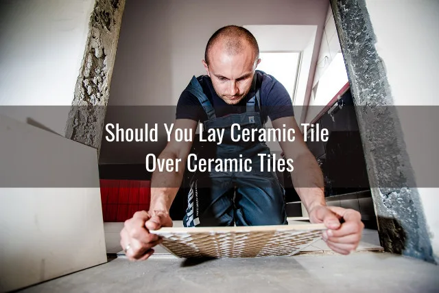 Man laying ceramic tiles