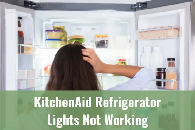 Confused woman looking at the refrigerator