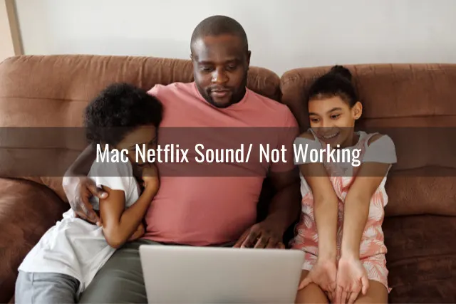 Father and daughter watching in the laptop