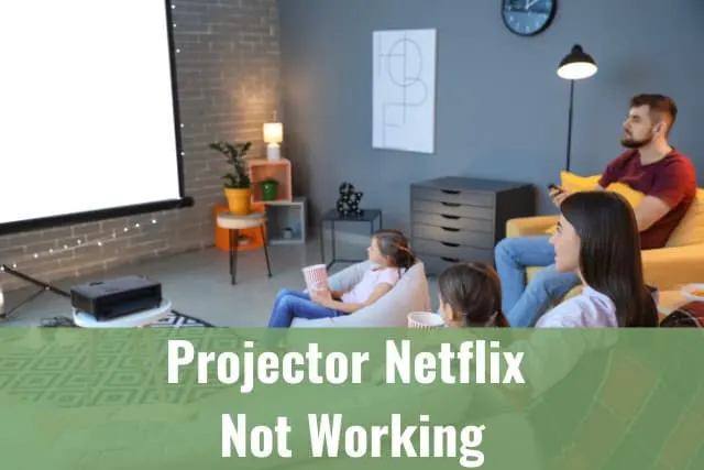 Family watching in the projector