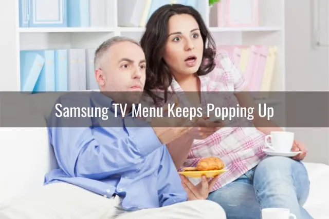 Confused couple watching TV
