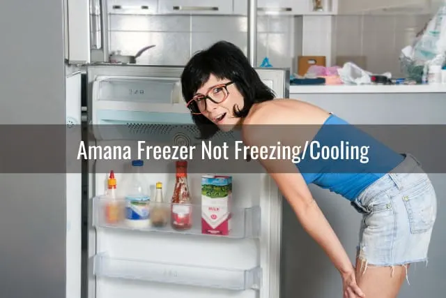 Confused woman looking at the refrigerator