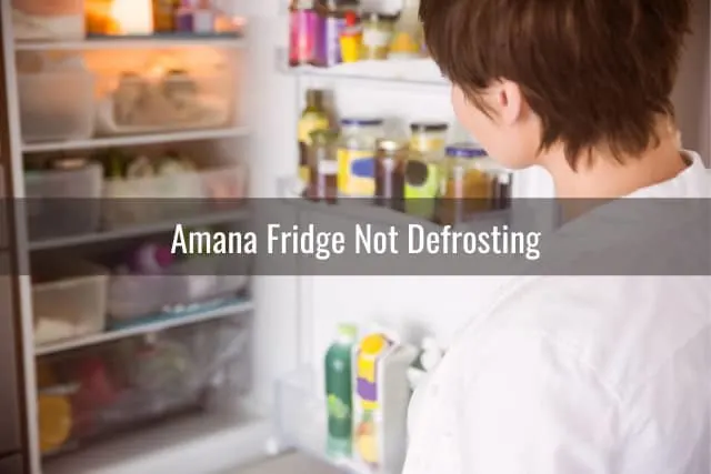 Confused woman looking at the refrigerator