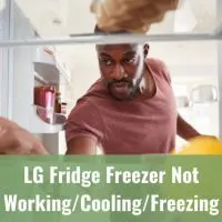 Man getting food inside the fridge