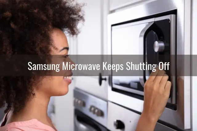 Woman adjusting the microwave