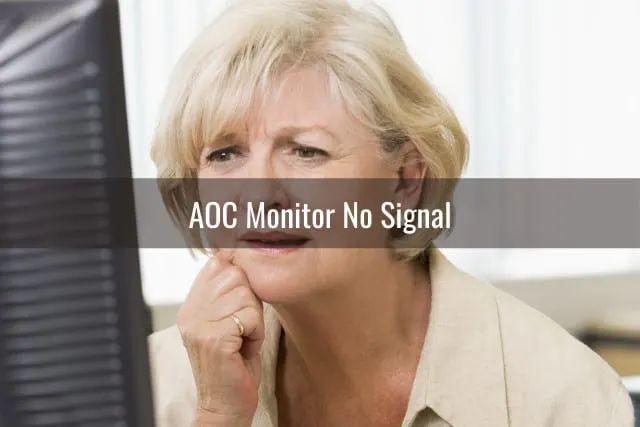 Confused woman while looking at the monitor