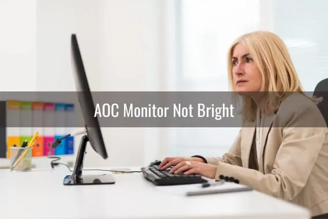 Confused woman while looking at the monitor