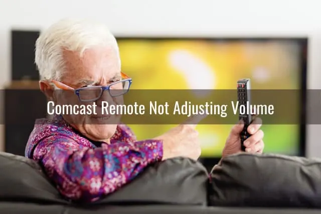 Frustrated man holding a remote