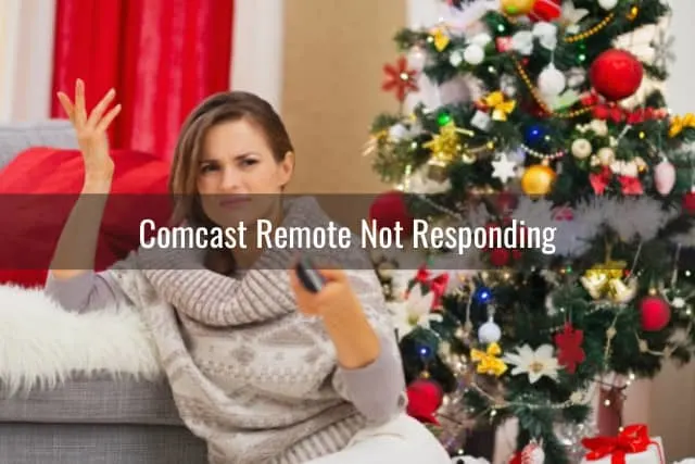 Confused woman while holding a remote