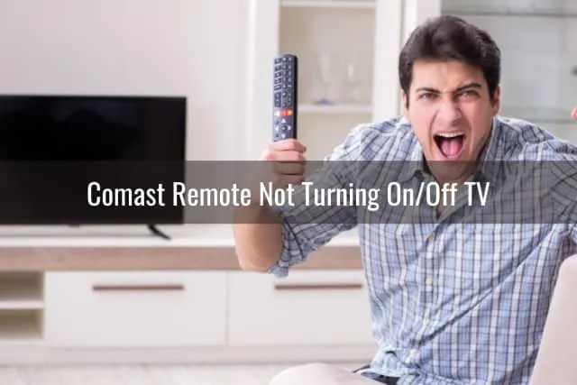 Frustrated man holding a remote