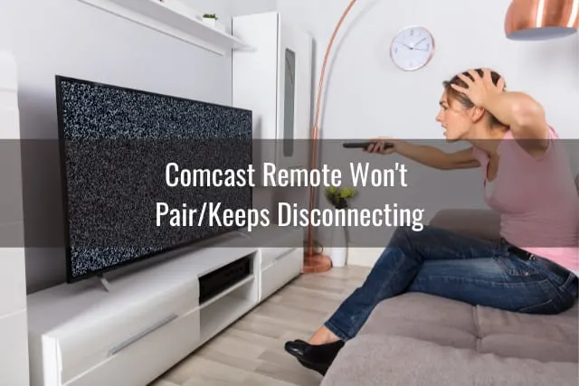Confused woman while holding a remote