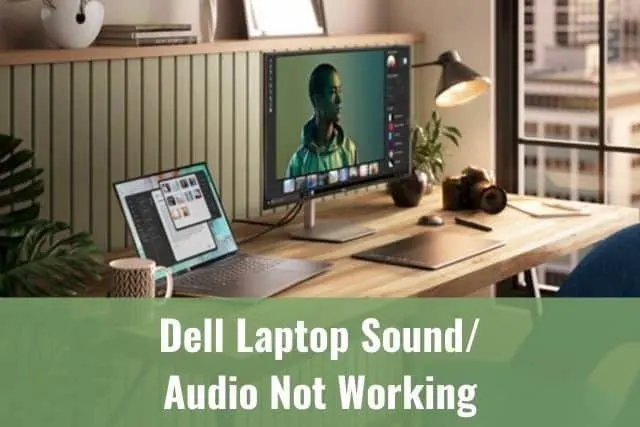 Laptop and monitor sitting on a wooden desk
