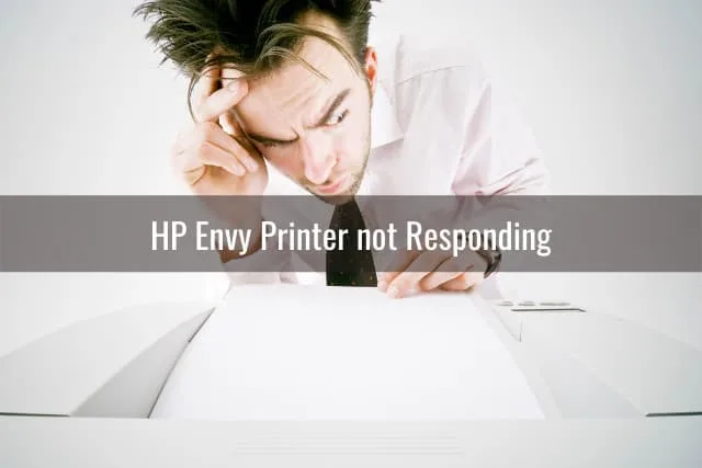 Thinking man while trying to operate the printer