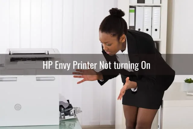Confused woman while looking at the printer