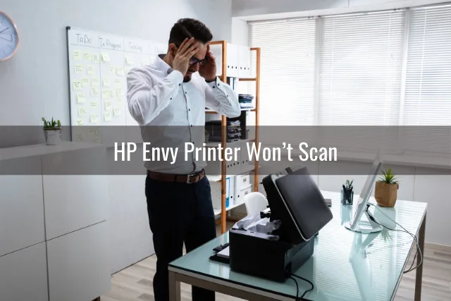 frustrated man while looking at the printer