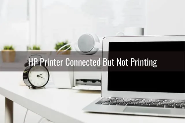 Printer and laptop on the desk table