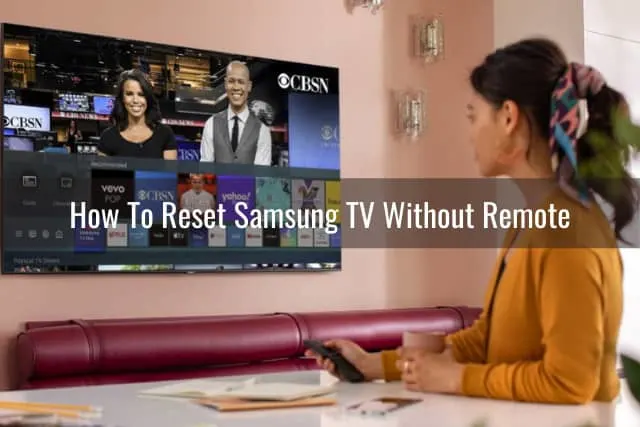 woman watching tv while holding a remote