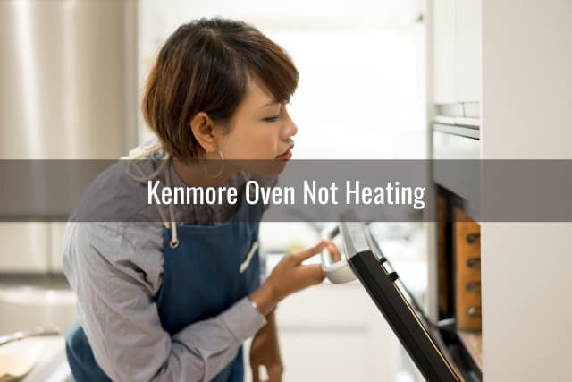 Woman checking the oven