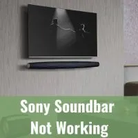 Black tv and soundbar placed on the wall