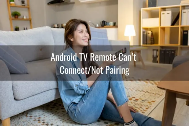 Woman holding a remote while pointing in the TV