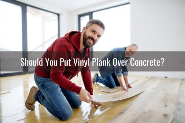 Man putting vinyl tile on the floor