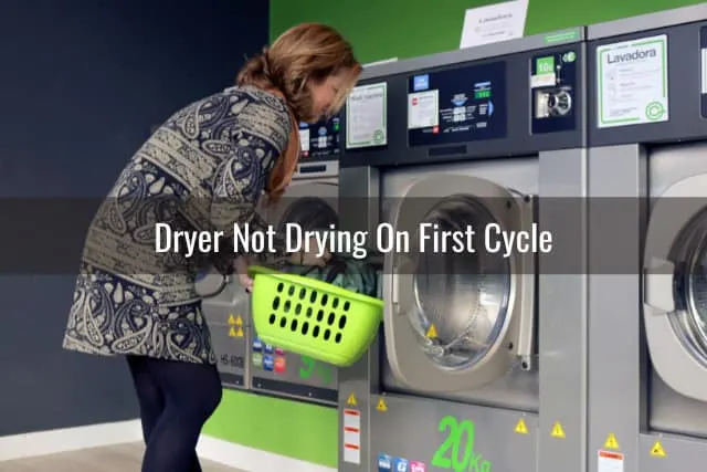 Woman putting clothes in dryer
