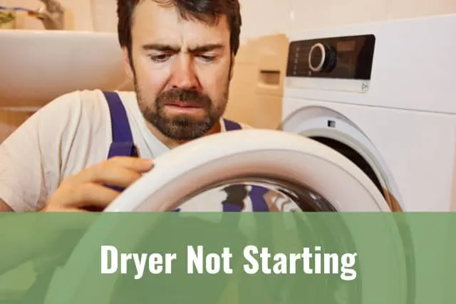 man fixing the dryer