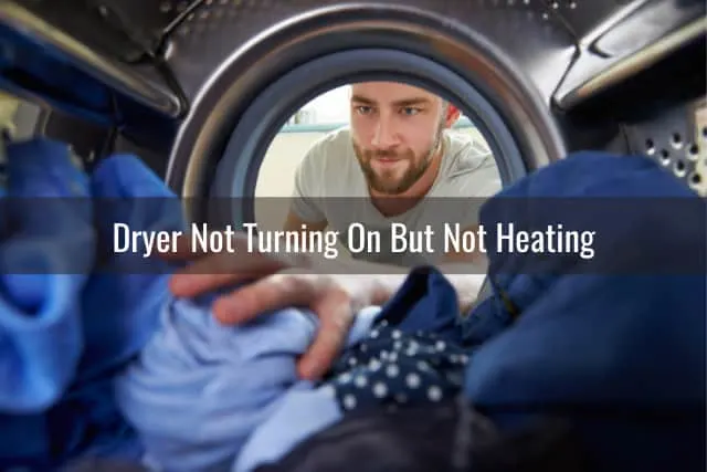 Man putting clothes on the dryer