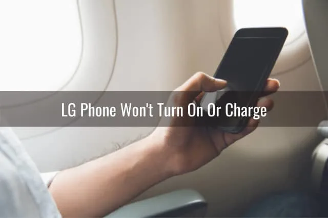 Holding a black LG phone